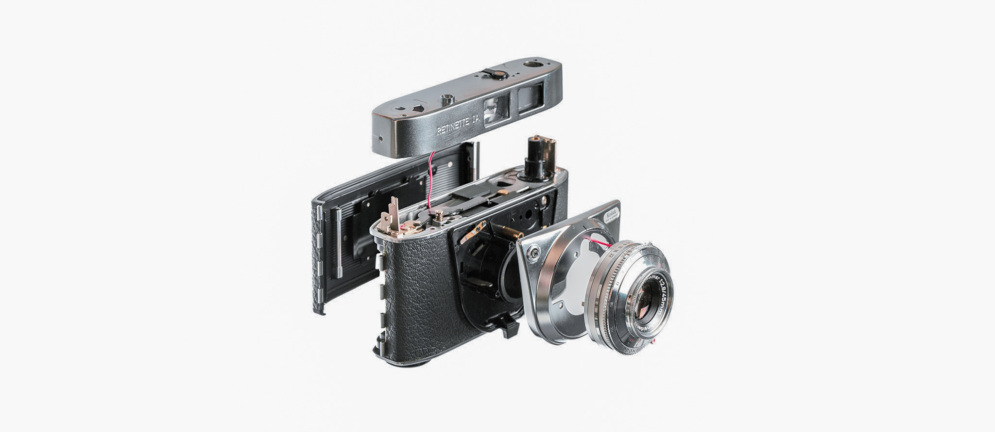 Exploded view of mechanical device on silk threads